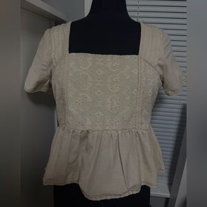 Woman’s cream blouse